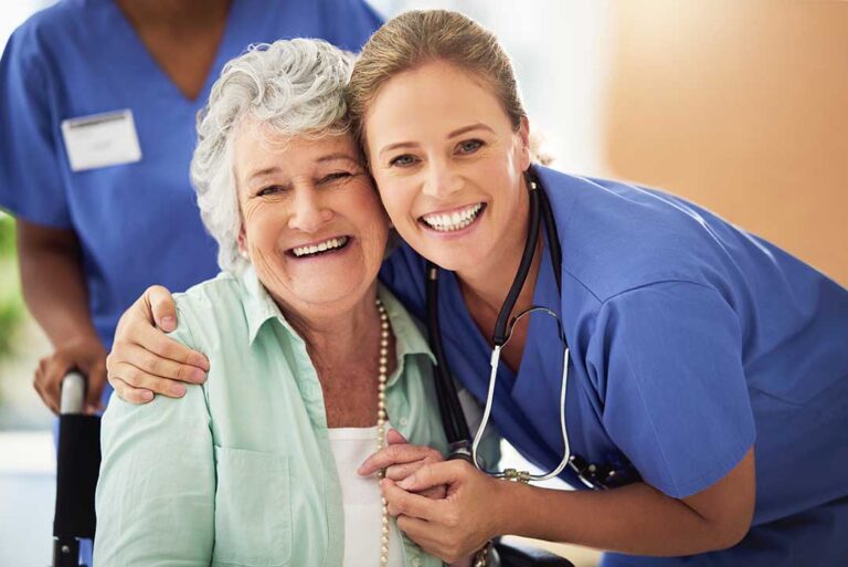 Older adult and family member reviewing home care and assisted living expenses at a kitchen table.